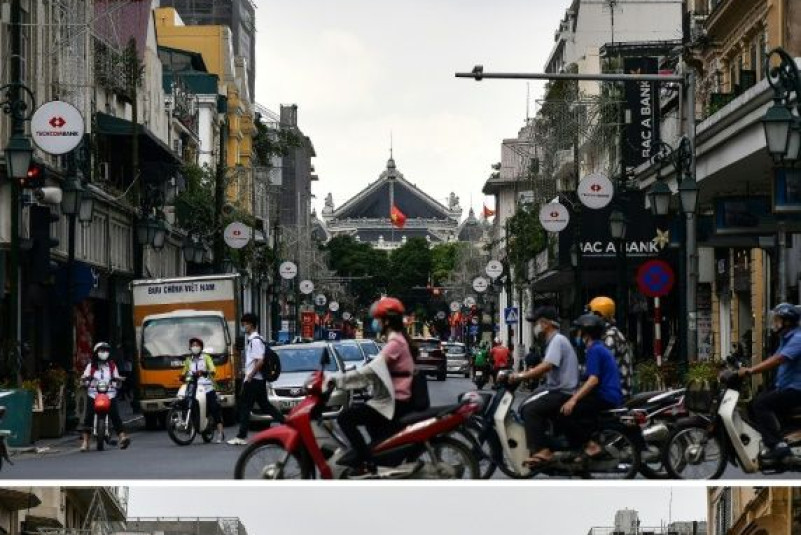 Mopeds once again fill every available space between the cars on Hanoi's streets
