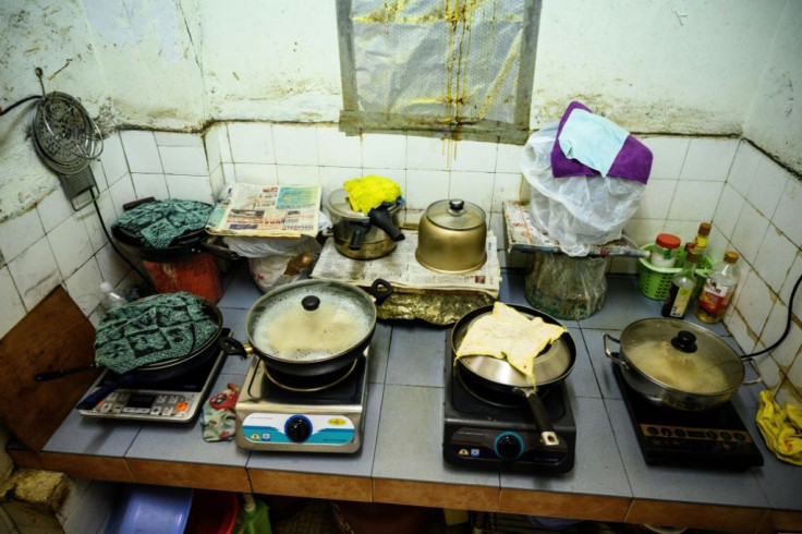 It's not easy to follow social distancing advice when residents have to line up to cook their meals in the shared kitchen