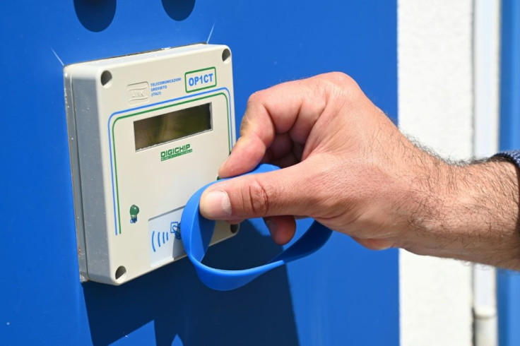 Customers may use electronic bracelets to enter sanitised bathrooms at a private beach in Jesolo, near Venice