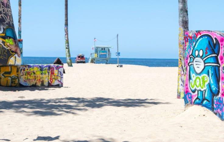 Even graffiti artists have weighed in with mask 'messages,' such as this one at freshly reopened Venice Beach, California