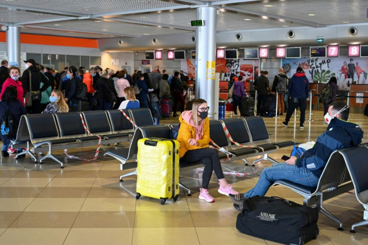 Ukrainian seasonal workers wait for the plane to Finland
