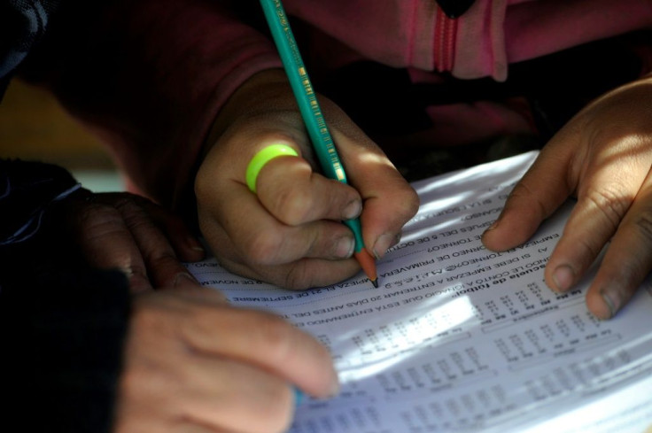 Children in the Lavalle desert in the far north of Argentina's Mendoza province do their homework during the coronavirus pandemic, even though most of them have no access to the internet
