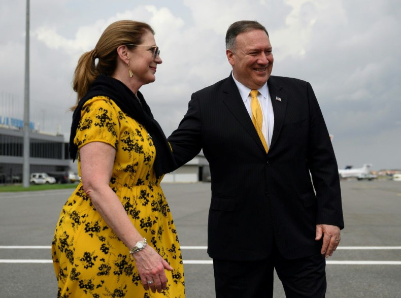 US Secretary of State Mike Pompeo and his wife Susan Pompeo walk on the tarmac of the Luanda airport on a February 2020 visit to Angola