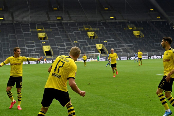 Erling Braut Haaland keeps his distance after opening the scoring in Borussia Dortmund's 4-0 win over local rivals Schalke