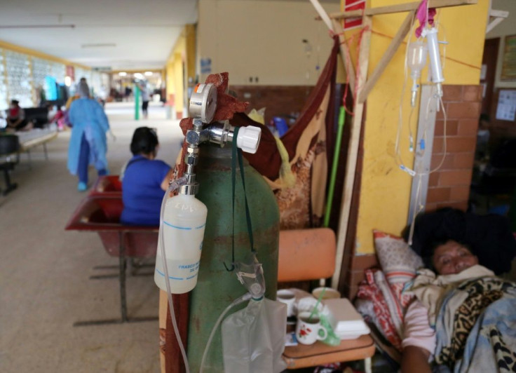 Patients with COVID-19 are treated in the corridor of a hospital in the Amazon city of Iquitos, on May 14, 2020