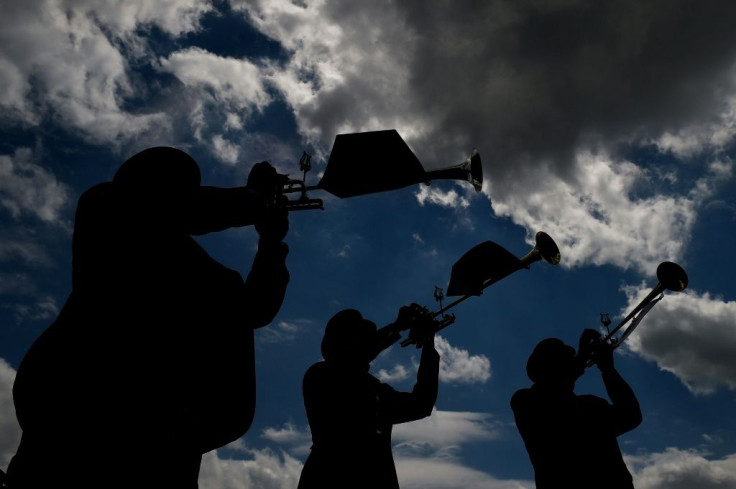 The Belmont Stakes buglers perform prior to the running of the 2014 Preakness Stakes at Pimlico Race Course in Baltimore