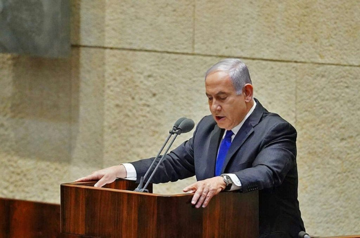 A picture provided by the Israeli Knesset shows Prime Minister Benjamin Netanyahu speaking ahead of the swearing-in of a unity government