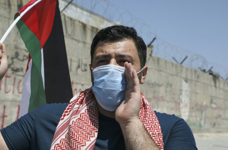 A Palestinian man takes part in a demonstration in the West Bank on May 16