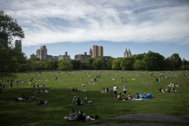 New Yorkers, practicing social distancing, enjoyed spring weather in Central Park, though authorities limited access to prevent contagion