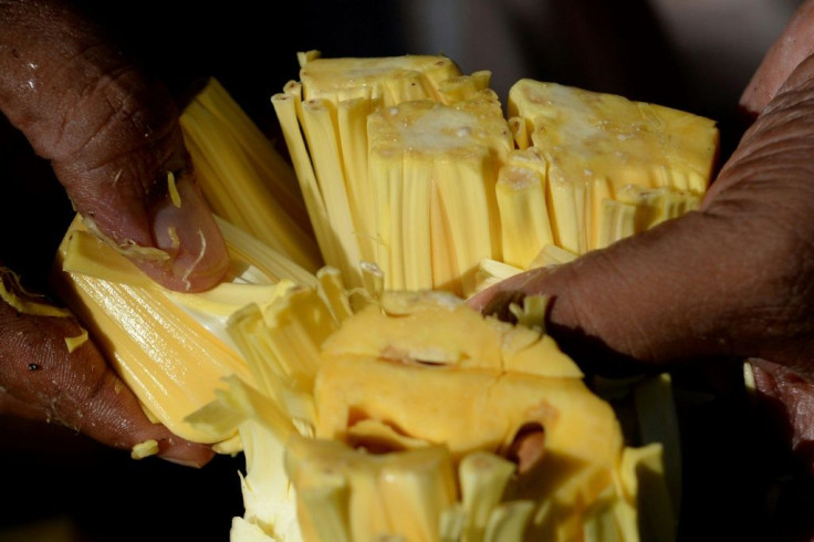 Jackfruit, which weighs five kilogrammes (11 pounds) on average, has a waxy yellow flesh when ripe and is eaten fresh, or used to make cakes, juices, ice creams and crisps