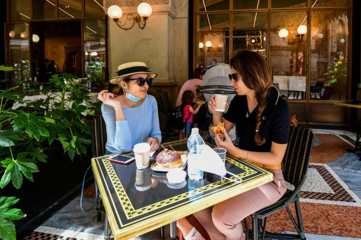 Some Milan residents availed themselves of the chance to enjoy a coffee and pastry on a cafe terrace for the first time after two months in lockdown