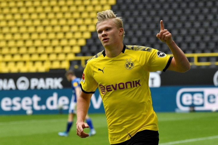 Dortmund striker Erling Braut Haaland celebrates in front of empty terraces in Saturday's 4-0 win over Schalke.