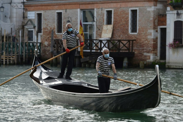Gondoliers returned to the canals of Venice, even if they are now wearing masks and gloves