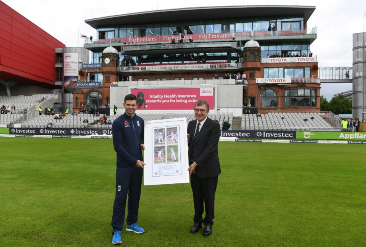 Late Lancashire chairman David Hodgkiss (right), makes a presentation to England's James Anderson at Old Trafford in 2017