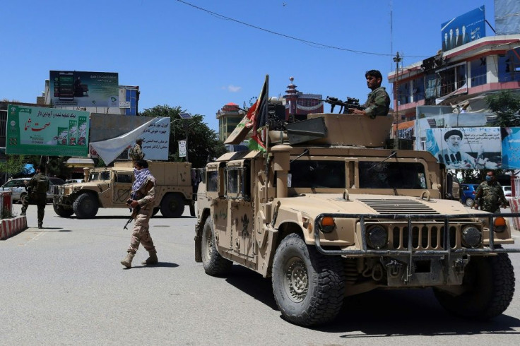 Afghan security forces patrol Kunduz after a Taliban assault on the city