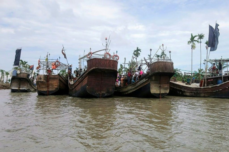 Residents from Dhalchar village being evacuated in fishing trawlers on the island of Bhola as Cyclone Amphan barrels towards Bangladesh