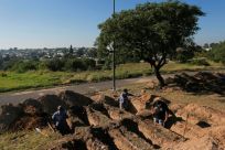 Grave diggers prepare plots at the San Vicente cemetery in Cordoba following a spike in coronavirus cases
