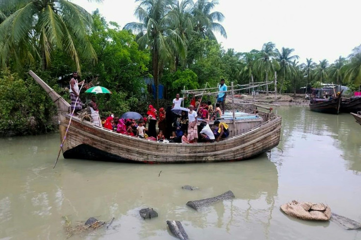 Residents from the village of Dhalchar are evacuated off of Bhola Island in Bangladesh in a fishing trawler as Super Cyclone Amphan barrels towards the coast