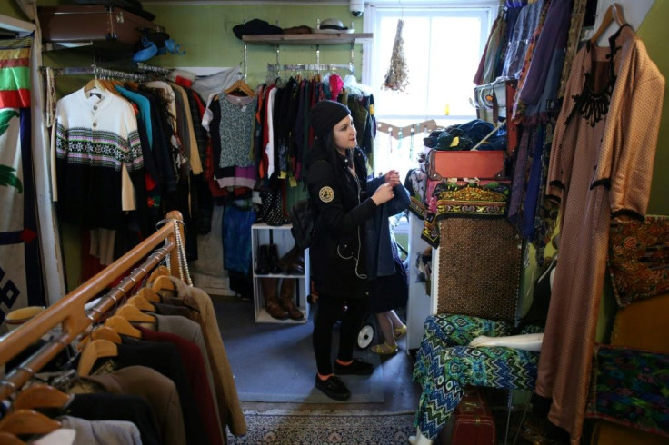 A shopper browses at a vintage clothing store in Ottawa,Ontario, as stores reopen after two months of lockdown