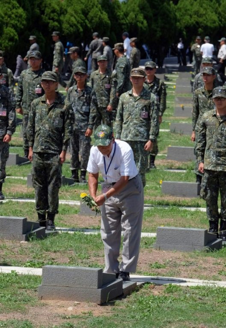 A war survivor pays his respects to a fallen comrade in August 2018 during the 60th anniversary of the Chinese bombardment of the tiny Taiwanese island of Kinmen that killed hundreds of people