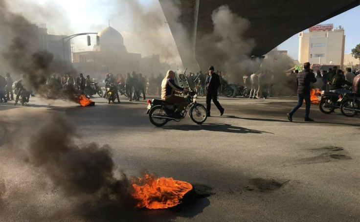Iranian protesters angered by an increase of up to 200 percent in the price of petrol gather under an overpass in the central city of Isfahan on November 16, 2019