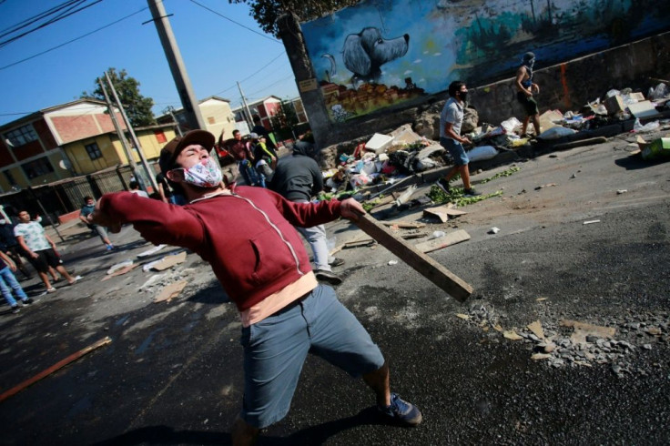 Protests have gripped parts of the Chilean capital, where demonstrators are complaining of a lack of food and work because of the virus