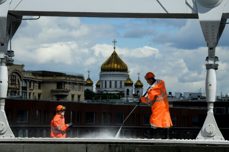 Russia reported a record high in daily deaths, but said the number of live infections was finally falling