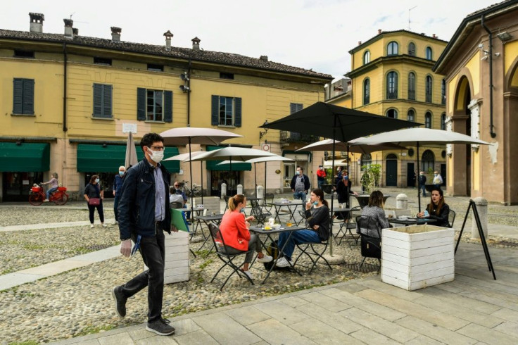 Codogno residents have a drink at a cafe terrace as Italy eases its lockdown aimed at curbing the spread of coronavirus