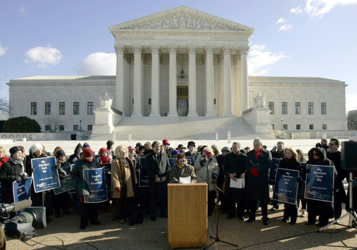 Norma McCorvey (C-Podium), the Roe of Roe v. Wade, speaks on the steps of the US Supreme Court on January 18, 2005 after petitioning the court to reverse its landmark decision that granted women the right to an abortion