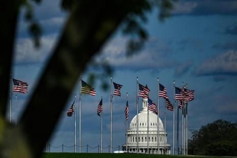 Top congressional Democrats have asked President Donald Trump to order US flags, such as these shown in the capital Washington, lowered to half staff when the nation's coronavirus death toll reaches 100,000