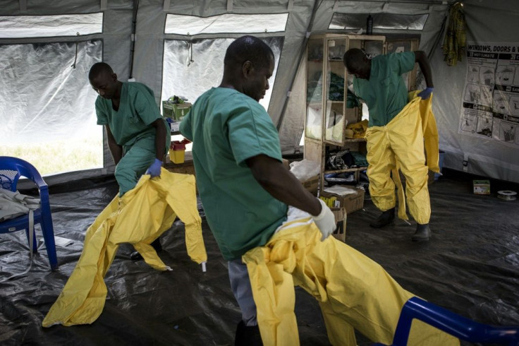 Virus threat: Medical workers in Beni don full protective gear -- not for COVID-19 but for Ebola. The deadly haemorrhagic fever broke out in North Kivu nearly 21 months ago