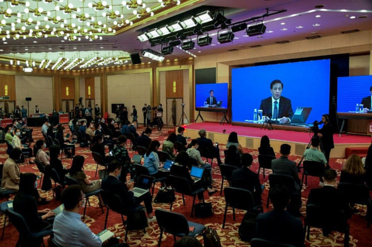 Zhang Yesui, seen here on the screen during a video press conference in Beijing on May 21, 2020, said China's parliament considered the move necessary