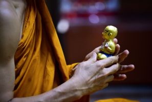 Older Thais venerate the supposed protective powers of the 'Golden Son' dolls