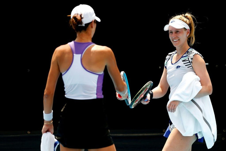 Well played: Ajla Tomljanovic and Alison Riske tap racquets in lieu of a hug as social distancing measures were enforced at the UTR Pro Match Series tennis mini-tournament