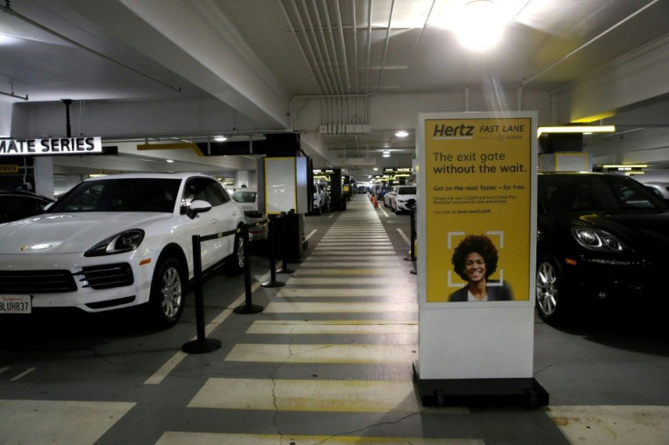 Cars sit idle at the Hertz Rent-A-Car rental lot at San Francisco International Airport in California on April 30, 2020.  Hertz says it has filed for bankruptcy in the US and Canada