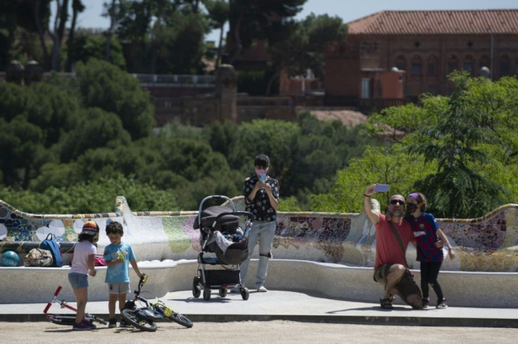 The locals take advantage of a beautiful day in a tourist-free Park Guell in Barcelona