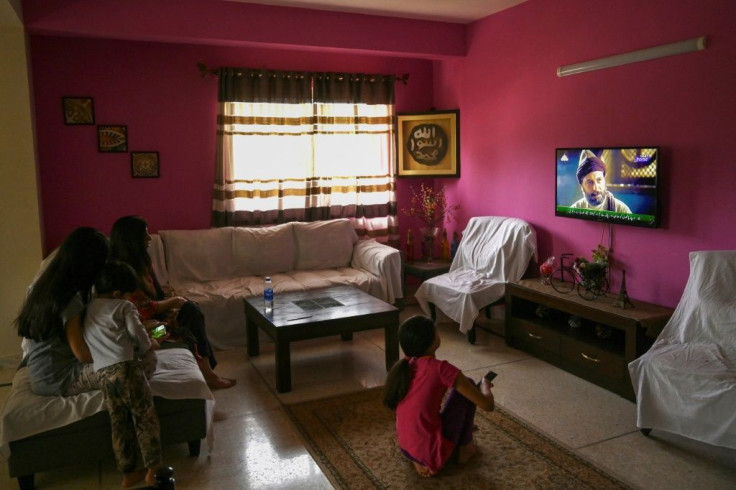 A Pakistani family enjoys the show Resurrection: Ertugrul in the capital Islamabad