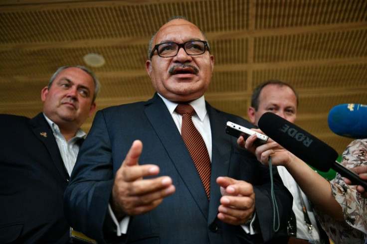 Papua New Guinea's former prime minister Peter O'Neill (C), pictured here in November 2018, has been arrested