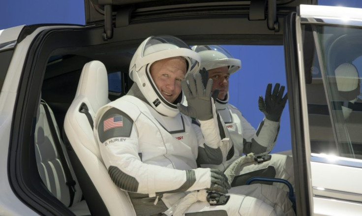 Douglas Hurley, left, and Robert Behnken, wearing SpaceX spacesuits, are seen as they depart for Launch Pad 39A on May 23, 2020 during a dress rehearsal prior to the mission launch, at NASA's Kennedy Space Center in Florida