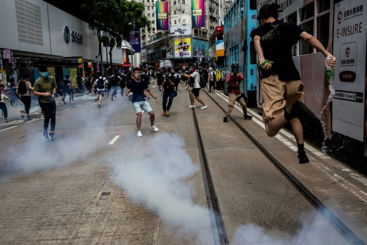 Riot police fired tear gas to disperse the protesters