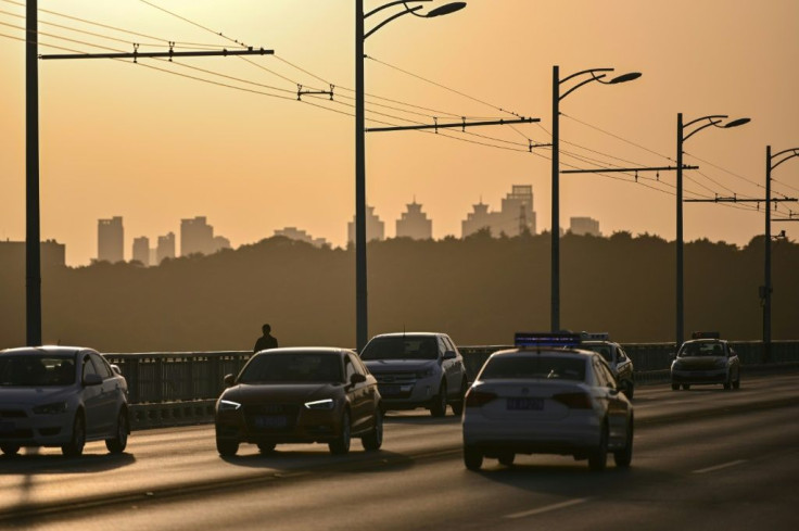 In major Chinese cities, prospective car buyers must win a number-plate lottery