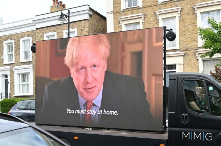 A screen on a truck showing Johnson outlining the rule that Cummings is accused of breaking