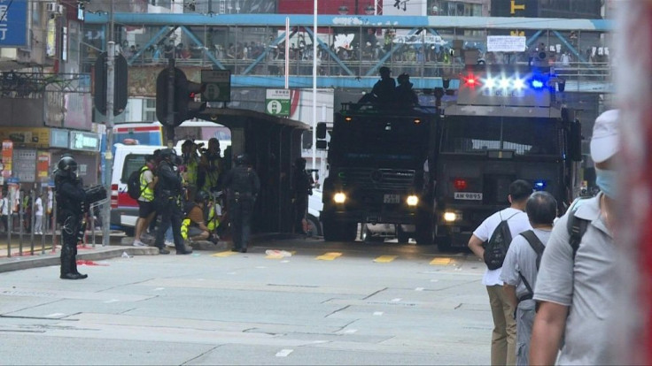 Police fire tear gas and water cannon at thousands of Hong Kong pro-democracy protesters who gather against a controversial security law proposed by China, in the most intense clashes in months.