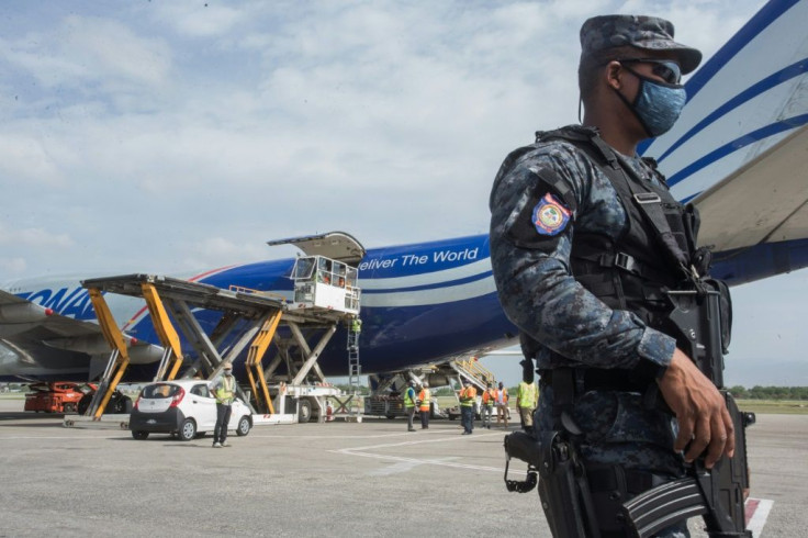 Chinese aid is unloaded from a plane in Haiti, one of many shipments of medical supplies by Beijing to combat the coronavirus