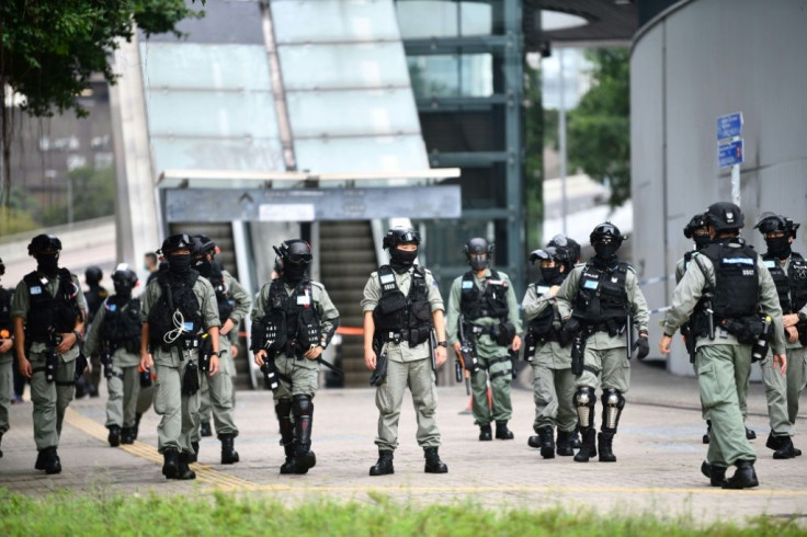 Riot police stand guard outside Hong Kong's legislature ahead of Wednesday's debate