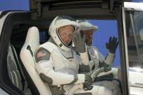 Douglas Hurley, left, and Bob Behnken, wearing SpaceX spacesuits, are seen as they depart for Launch Complex 39A during a launch dress rehearsal on May 23, 2020, at NASA's Kennedy Space Center in Florida