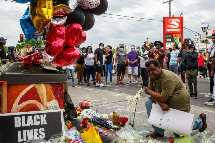 People left flowers and balloons at a makeshift memorial for George Floyd who died in police  custody on May 26, 2020 in Minneapolis