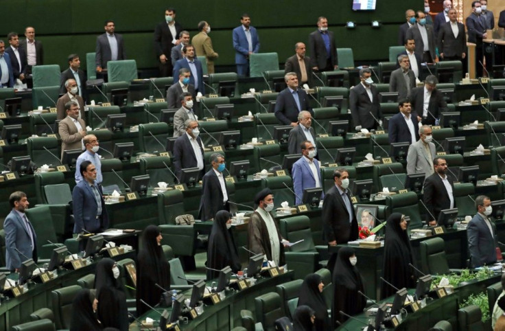 For the opening session of Iran's new parliament, a seat was left vacant between each lawmaker in accordance with social distancing guidelines although few wore masks against the coronavirus