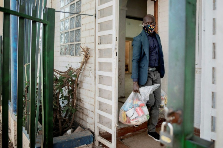 A Senegalese community leader brings food parcels to people in need in  Johannesburg