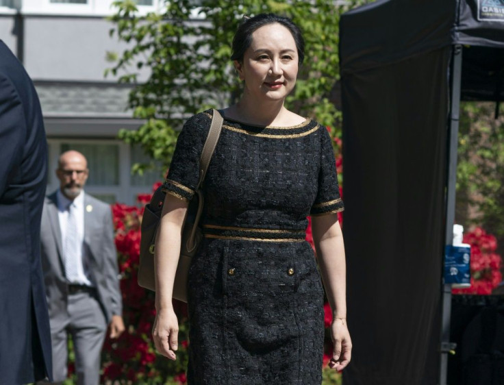 Meng Wanzhou, CFO of Huawei, walks down her driveway to her car as she departs her home for court on May 27, 2020 in Vancouver, Canada